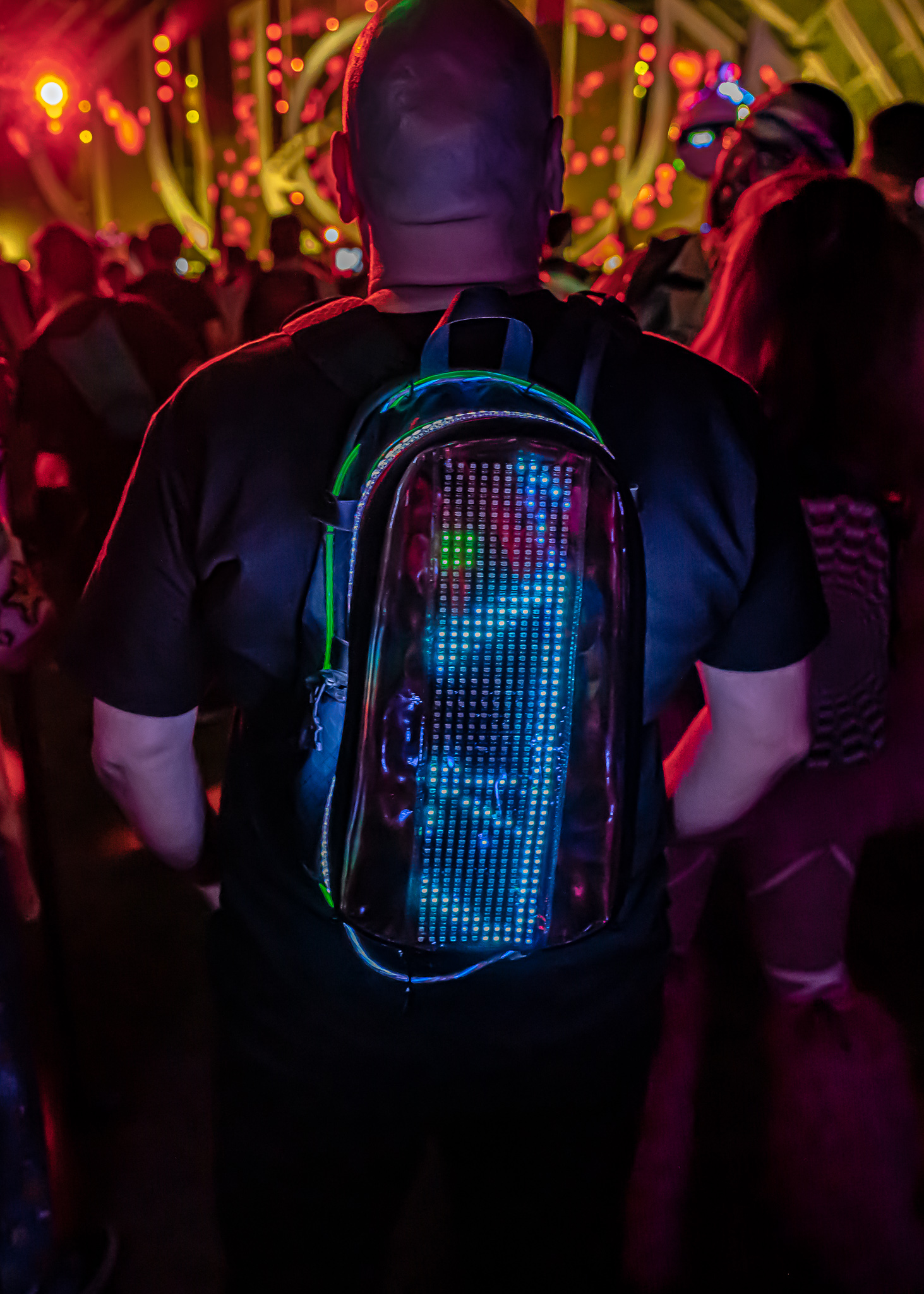 Festival-goer with Lunchbox pack secure in crowd