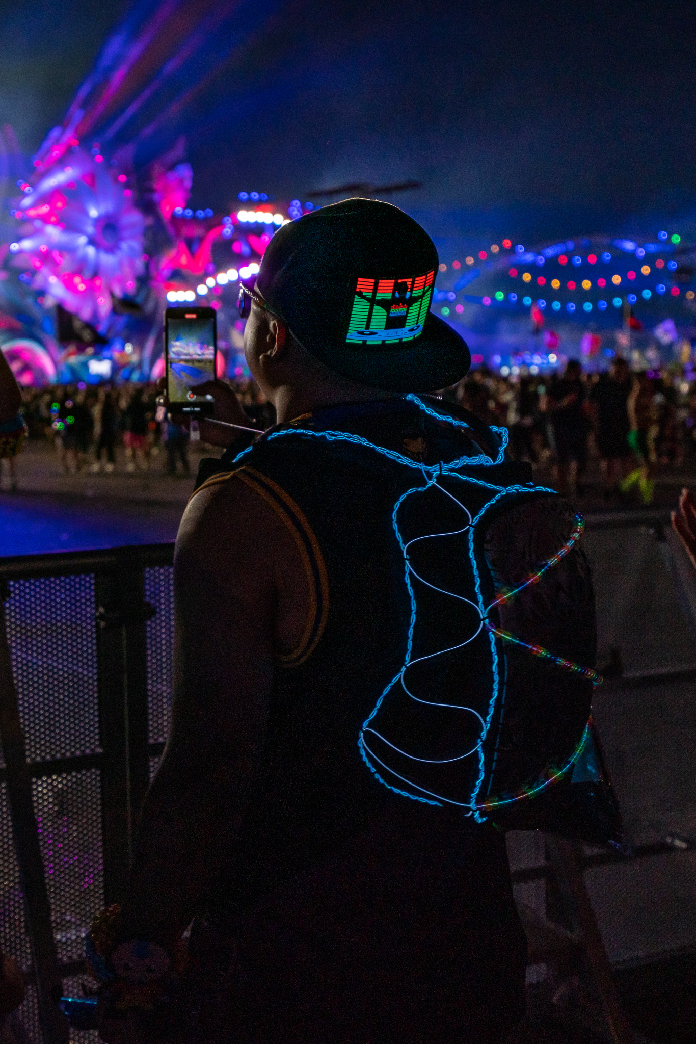Festival-goer at rail with Lunchbox pack