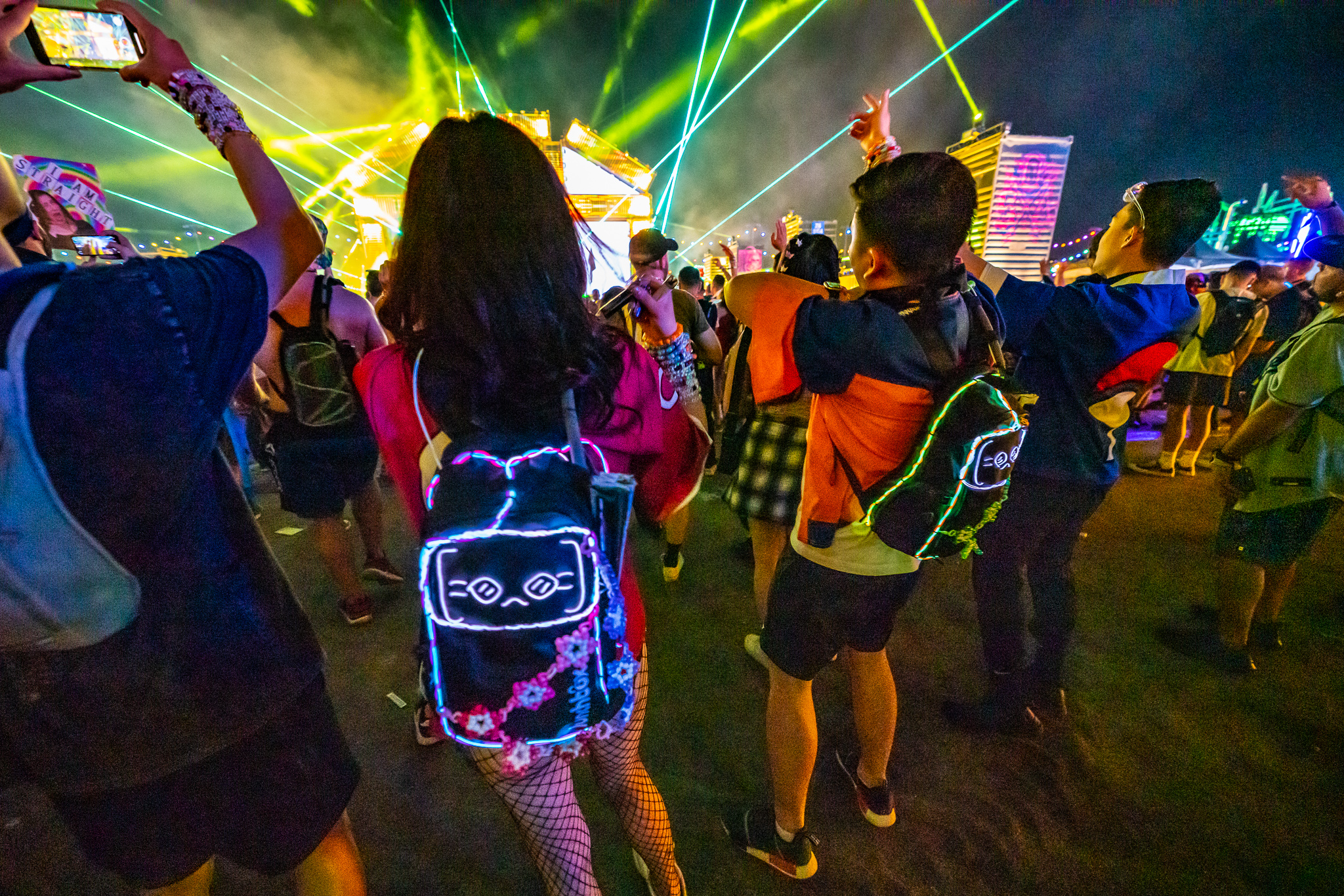 Multiple festival-goers with Lunchbox packs in crowd